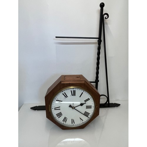 205 - A 12 inch double sided GPO hanging clock with a fusee movement. Features a fully serviced and cleane... 