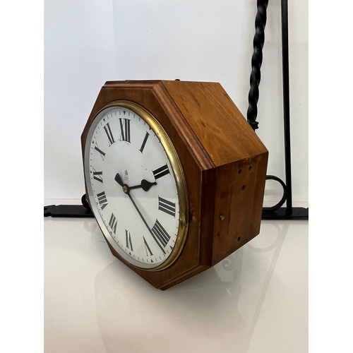 205 - A 12 inch double sided GPO hanging clock with a fusee movement. Features a fully serviced and cleane... 