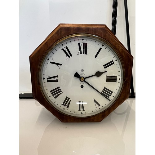 205 - A 12 inch double sided GPO hanging clock with a fusee movement. Features a fully serviced and cleane... 