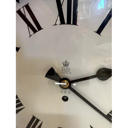 205 - A 12 inch double sided GPO hanging clock with a fusee movement. Features a fully serviced and cleane... 