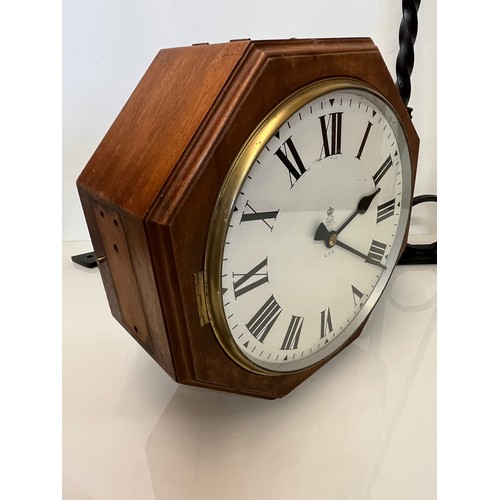 205 - A 12 inch double sided GPO hanging clock with a fusee movement. Features a fully serviced and cleane... 