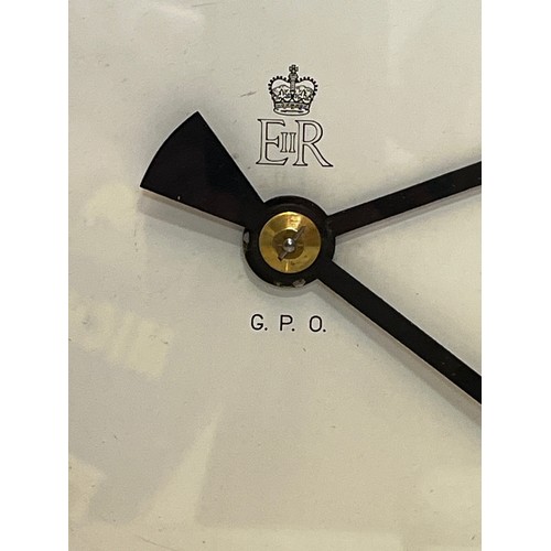 205 - A 12 inch double sided GPO hanging clock with a fusee movement. Features a fully serviced and cleane... 