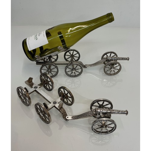 428 - English Silver plate wine bottle gun carriage for the dining table and another.

This lot is availab... 