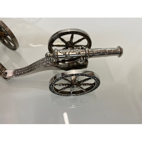 428 - English Silver plate wine bottle gun carriage for the dining table and another.

This lot is availab... 