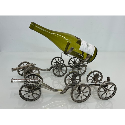 428 - English Silver plate wine bottle gun carriage for the dining table and another.

This lot is availab... 