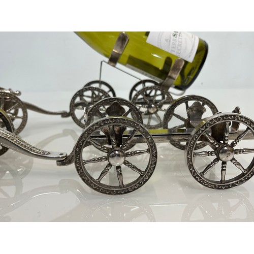 428 - English Silver plate wine bottle gun carriage for the dining table and another.

This lot is availab... 