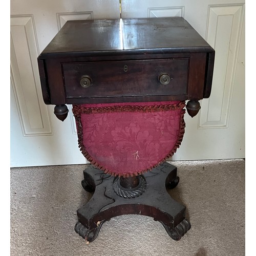 235 - A drop leaf mahogany sewing table raised on a single column base, and with a faux drawer to the rear... 