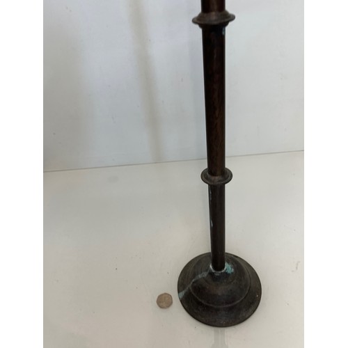 471 - A patinated brass candle stand 83 cm tall.

This lot is available for in-house shipping