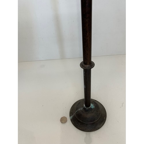 471 - A patinated brass candle stand 83 cm tall.

This lot is available for in-house shipping