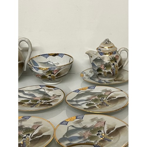 417 - Decorative Japanese tea set with scenes incorporating Mount Fuji, tea pot, sugar bowl and 12 cups an... 