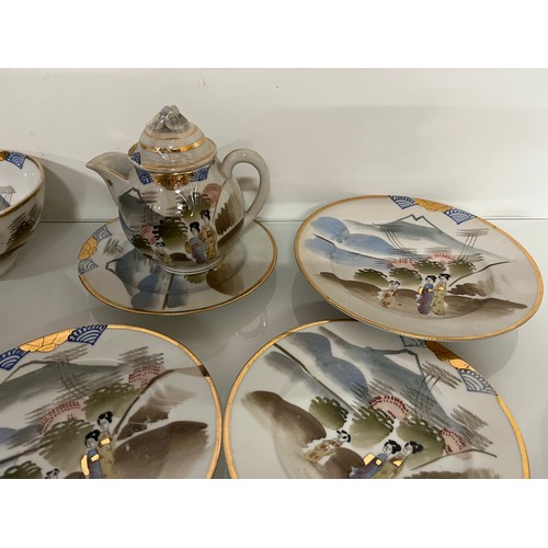 417 - Decorative Japanese tea set with scenes incorporating Mount Fuji, tea pot, sugar bowl and 12 cups an... 