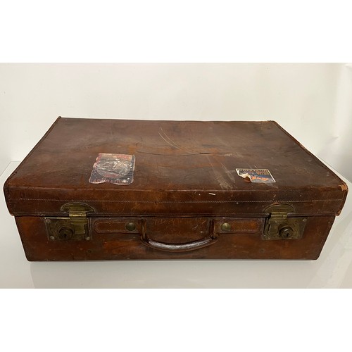 383 - Early C20th luggage, a leather suitcase marked for Selfridge London, with travel label illustrated w... 