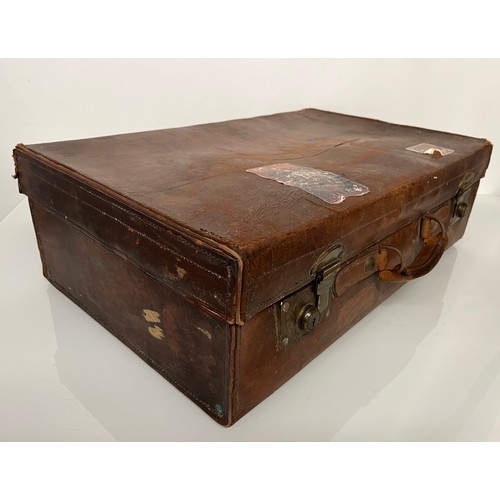 383 - Early C20th luggage, a leather suitcase marked for Selfridge London, with travel label illustrated w... 