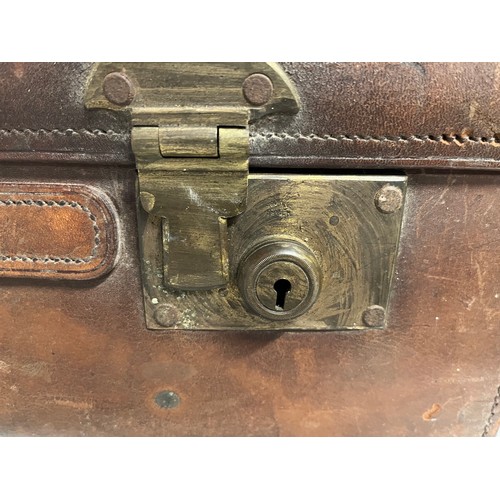 383 - Early C20th luggage, a leather suitcase marked for Selfridge London, with travel label illustrated w... 