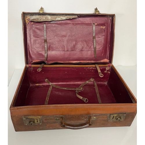 383 - Early C20th luggage, a leather suitcase marked for Selfridge London, with travel label illustrated w... 