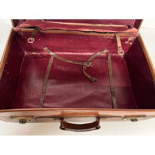 383 - Early C20th luggage, a leather suitcase marked for Selfridge London, with travel label illustrated w... 