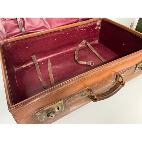 383 - Early C20th luggage, a leather suitcase marked for Selfridge London, with travel label illustrated w... 