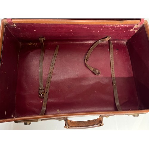 383 - Early C20th luggage, a leather suitcase marked for Selfridge London, with travel label illustrated w... 