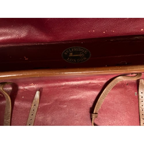 383 - Early C20th luggage, a leather suitcase marked for Selfridge London, with travel label illustrated w... 