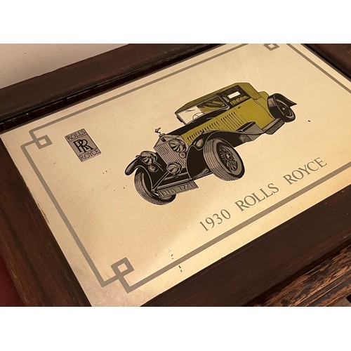 502 - Framed wall mirror decorated with an illustration of a 1930 Rolls Royce.

This lot is available for ... 