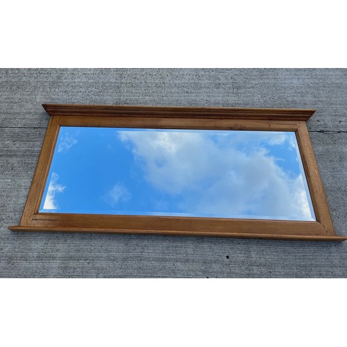 348 - A very large oak framed bevel edged wall mirror 220 cm long 101 cm high.

This lot is collection onl... 