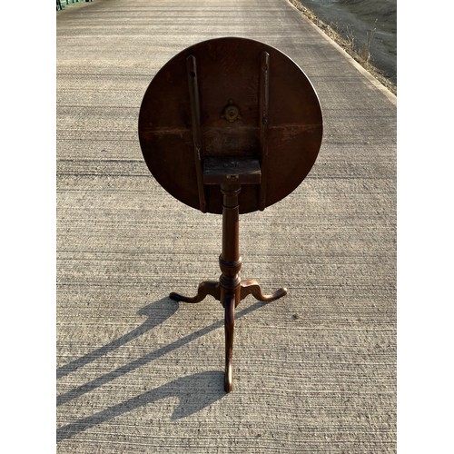 357 - Mahogany tilt top circular topped side table, 50 cm in diameter, 69 cm tall.

This lot is collection... 