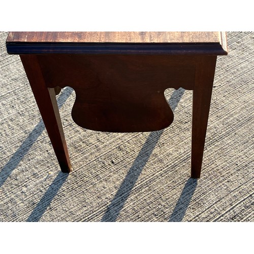 362 - Mahogany storage table with a hinged top accessing a storage area,  51 cm x 43 cm x 49 cm high.