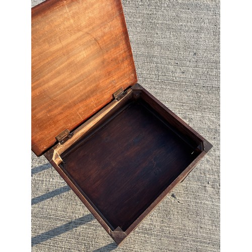 362 - Mahogany storage table with a hinged top accessing a storage area,  51 cm x 43 cm x 49 cm high.