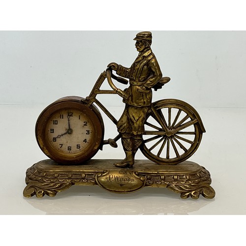 27 - A veteran era cycling themed mantle clock, marked for P woods.

This lot is available for in-house s... 