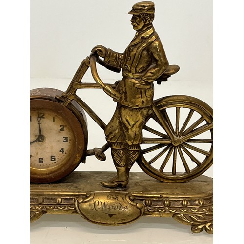 27 - A veteran era cycling themed mantle clock, marked for P woods.

This lot is available for in-house s... 