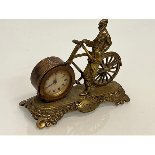 27 - A veteran era cycling themed mantle clock, marked for P woods.

This lot is available for in-house s... 