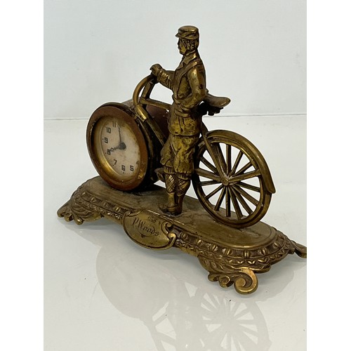 27 - A veteran era cycling themed mantle clock, marked for P woods.

This lot is available for in-house s... 