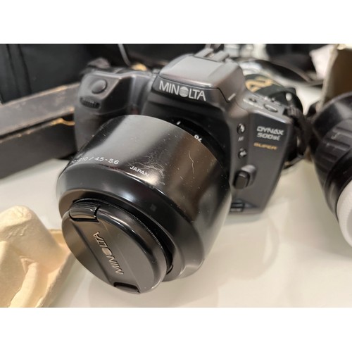 48 - Digital photography and digital filming, bagged cameras and lenses, Minolta etc.

This lot is availa... 