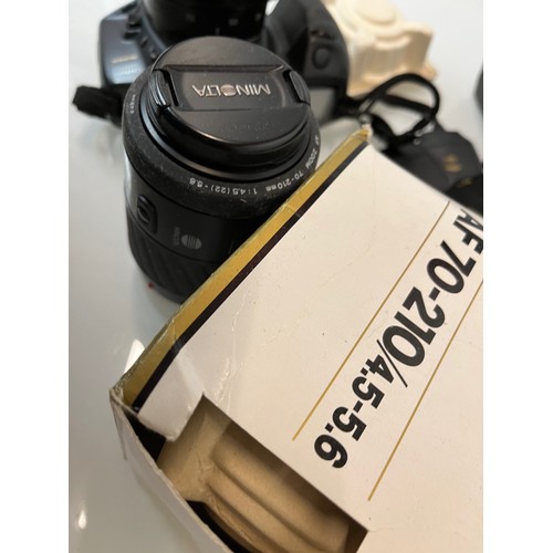 48 - Digital photography and digital filming, bagged cameras and lenses, Minolta etc.

This lot is availa... 