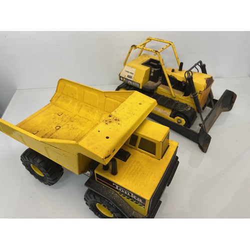 51 - Tonka toys, tinplate models a dump truck and a bulldozer.

This lot is available for in-house shippi... 