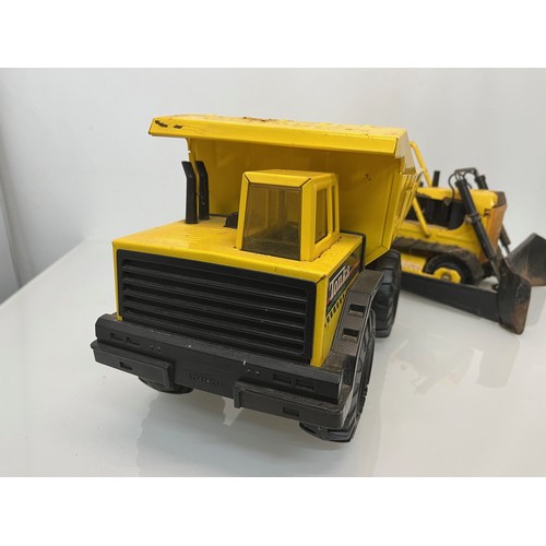 51 - Tonka toys, tinplate models a dump truck and a bulldozer.

This lot is available for in-house shippi... 