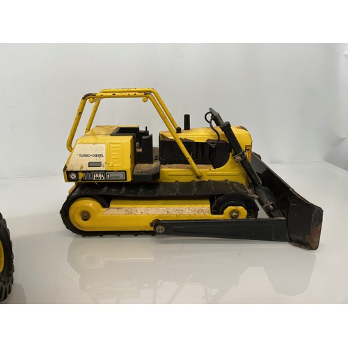 51 - Tonka toys, tinplate models a dump truck and a bulldozer.

This lot is available for in-house shippi... 