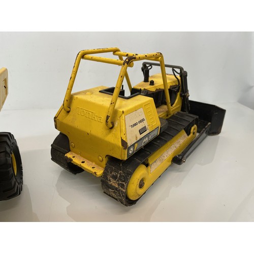 51 - Tonka toys, tinplate models a dump truck and a bulldozer.

This lot is available for in-house shippi... 