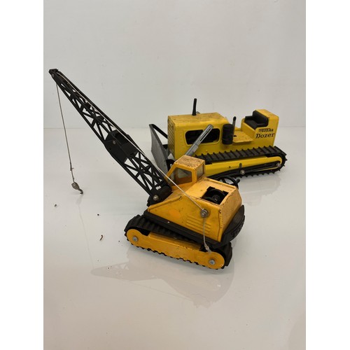 52 - Tonka toys, tinplate models a tracked crane and a bulldozer.

This lot is available for in-house shi... 