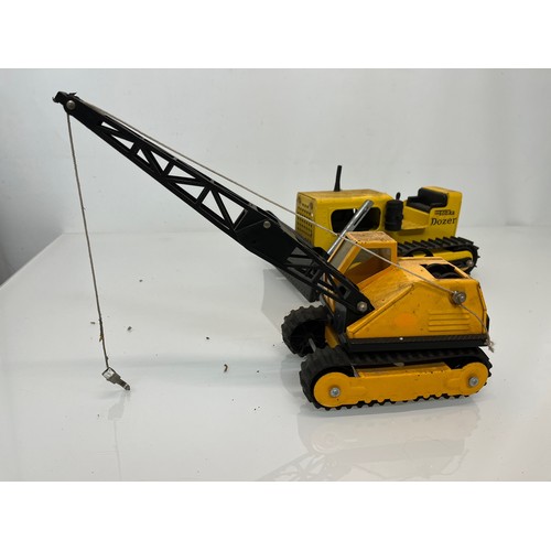 52 - Tonka toys, tinplate models a tracked crane and a bulldozer.

This lot is available for in-house shi... 