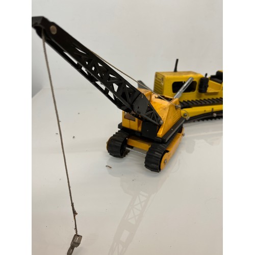 52 - Tonka toys, tinplate models a tracked crane and a bulldozer.

This lot is available for in-house shi... 