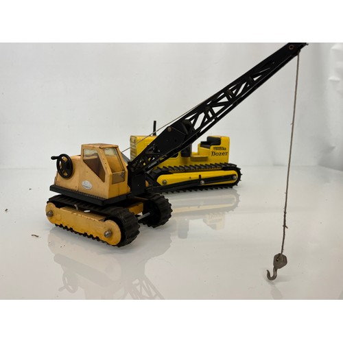 52 - Tonka toys, tinplate models a tracked crane and a bulldozer.

This lot is available for in-house shi... 