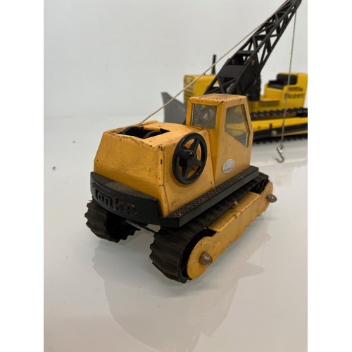 52 - Tonka toys, tinplate models a tracked crane and a bulldozer.

This lot is available for in-house shi... 