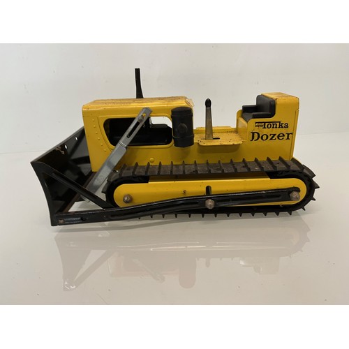 52 - Tonka toys, tinplate models a tracked crane and a bulldozer.

This lot is available for in-house shi... 