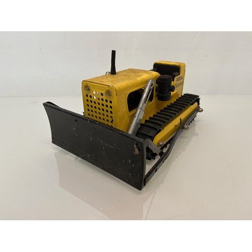 52 - Tonka toys, tinplate models a tracked crane and a bulldozer.

This lot is available for in-house shi... 