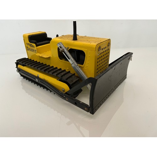 52 - Tonka toys, tinplate models a tracked crane and a bulldozer.

This lot is available for in-house shi... 