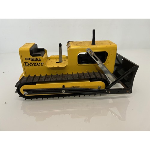 52 - Tonka toys, tinplate models a tracked crane and a bulldozer.

This lot is available for in-house shi... 