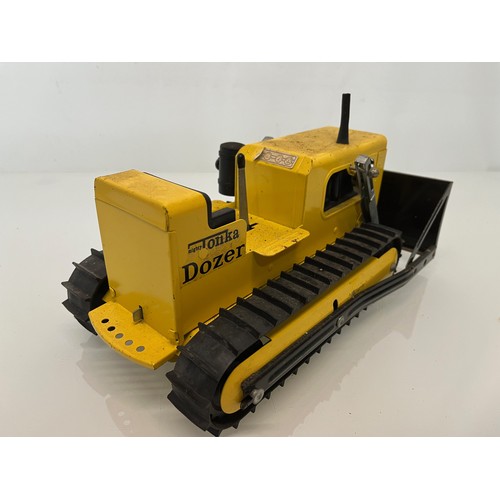 52 - Tonka toys, tinplate models a tracked crane and a bulldozer.

This lot is available for in-house shi... 