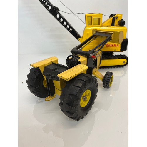 53 - Tonka toys, tinplate models a large crane and a tractor.

This lot is available for in-house shippin... 