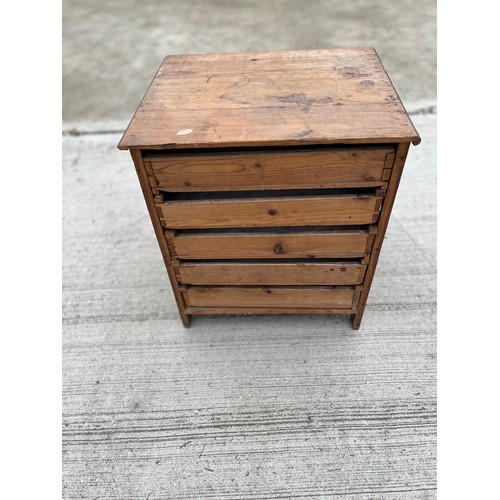 93 - Pine collectors cabinet five drawer sections behind two doors. 45 x 39 cm x 52 cm high.

This lot is... 